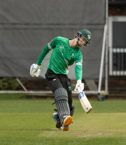 Bucks Cricket clothing on a batsman running into the crease.
